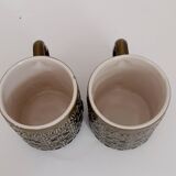 Duo of BP 70's slip mugs