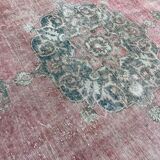 Pale pink rug with medallion