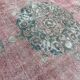 Tapis rose pâle avec médaillon