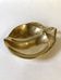 Brass catchall in the shape of an apple.