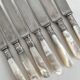 Antique table knives in mother-of-pearl and silver-plated metal