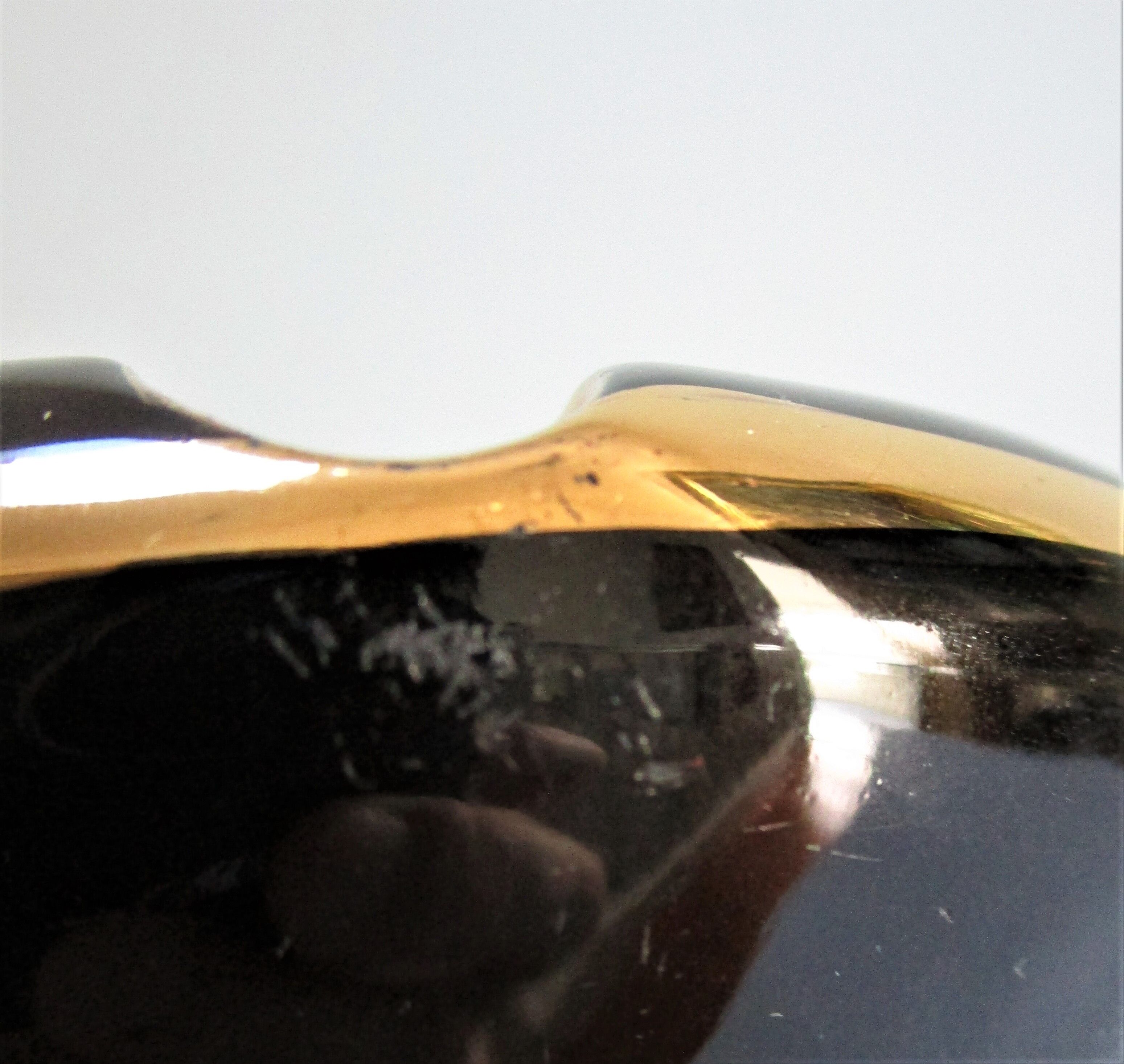 Black ceramic ashtray and vintage gold 50/60