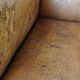 Antique armchair in patinated sheepskin