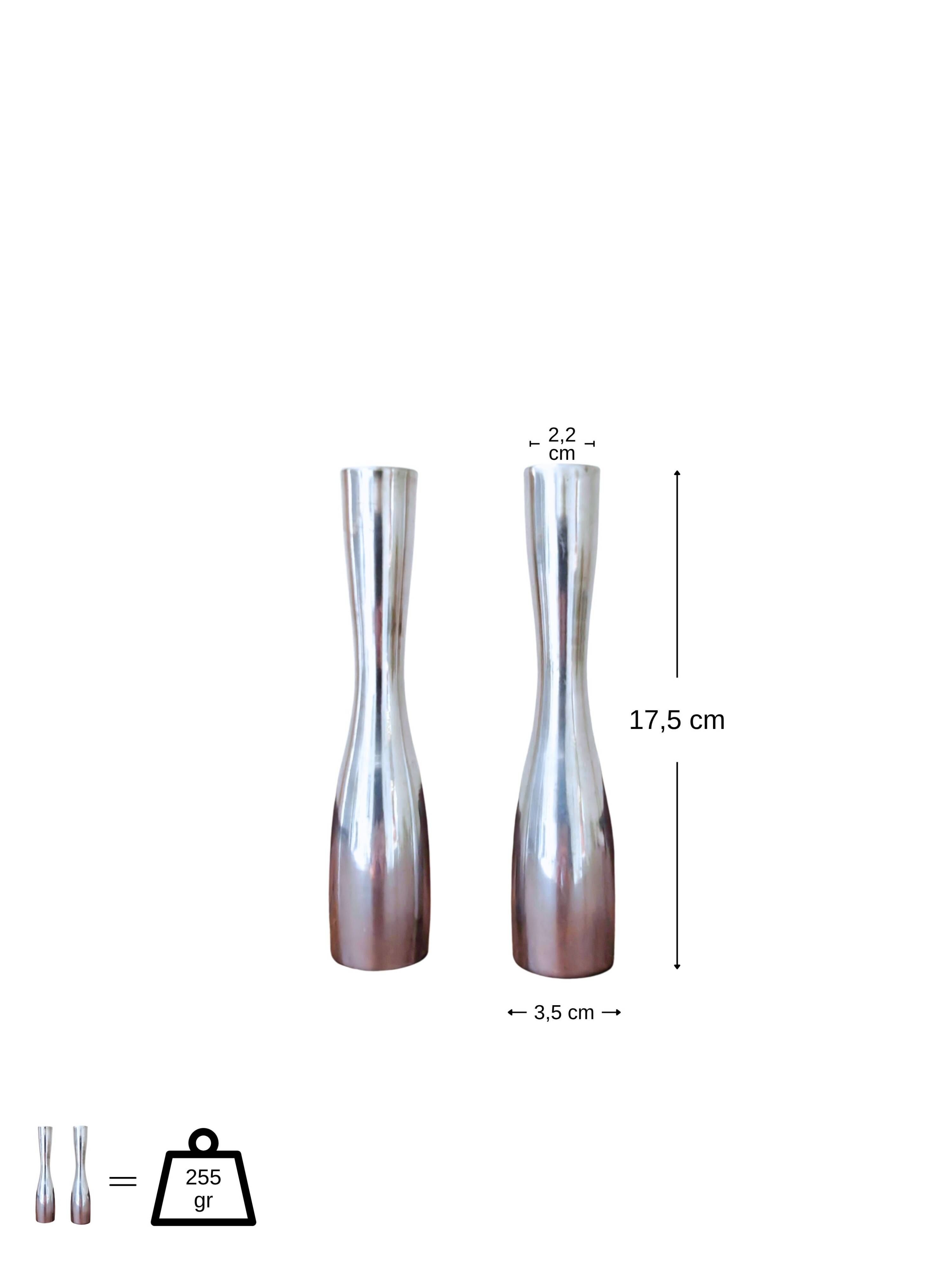 Pair of minimalist aluminium candlesticks in the style of Erika Pekkar.