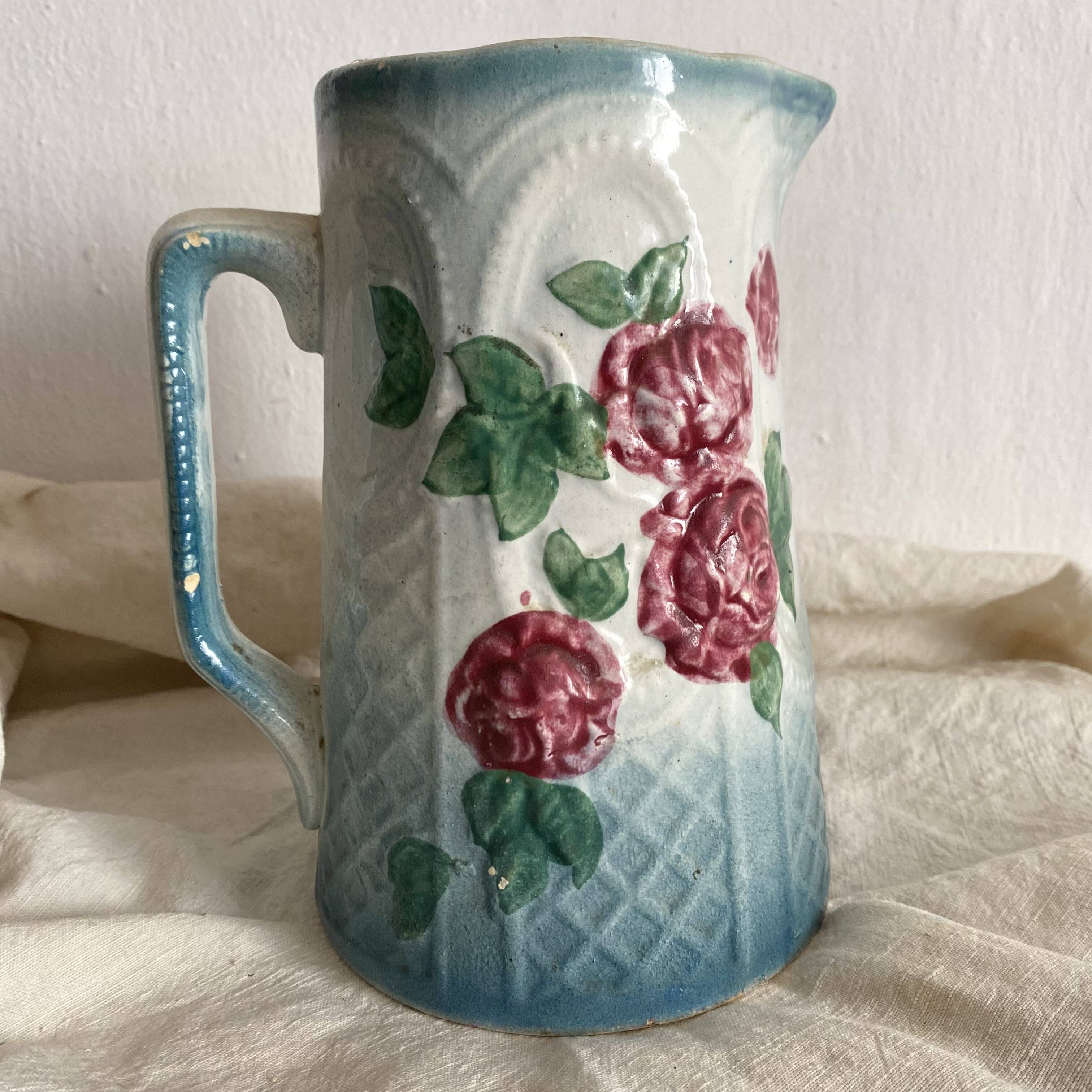 Art Nouveau slip pitcher with roses
