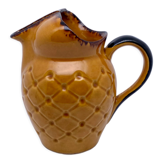 Yellow and brown ceramic pitcher