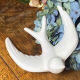Pair of plaster swallows
