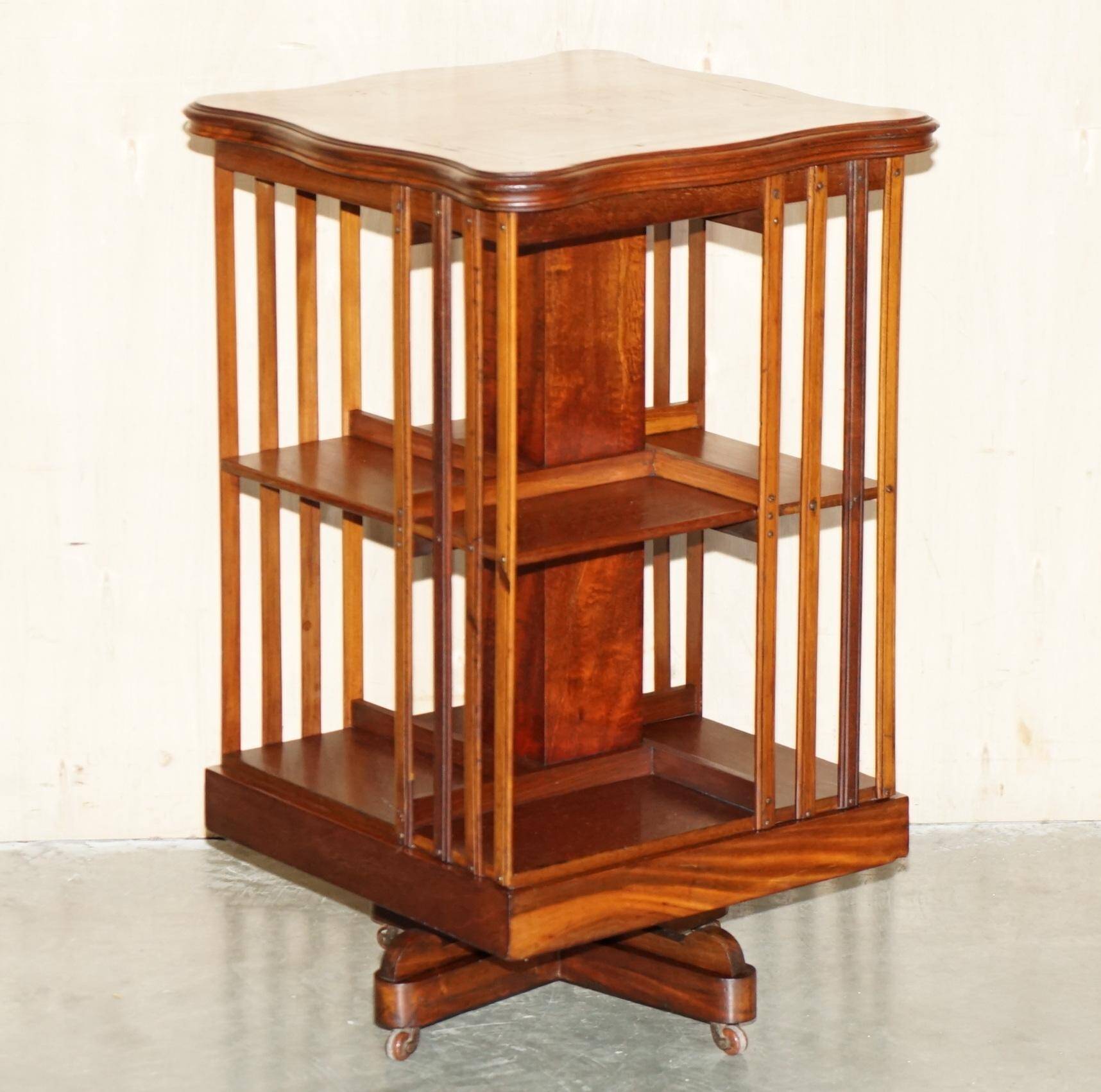 Sheraton-style rotating library table in walnut and satinwood.