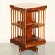 Sheraton-style rotating library table in walnut and satinwood.