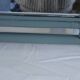 Sage green painted rattan mirror