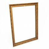 A mirror in a golden frame