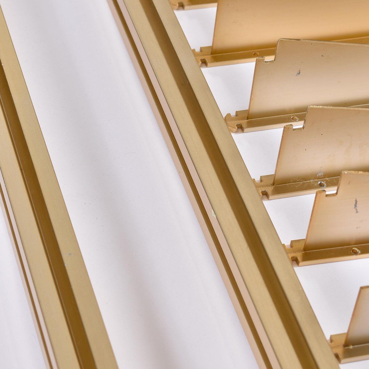 Tension pole free standing rose gold aluminum Omni wall unit by George Nelson