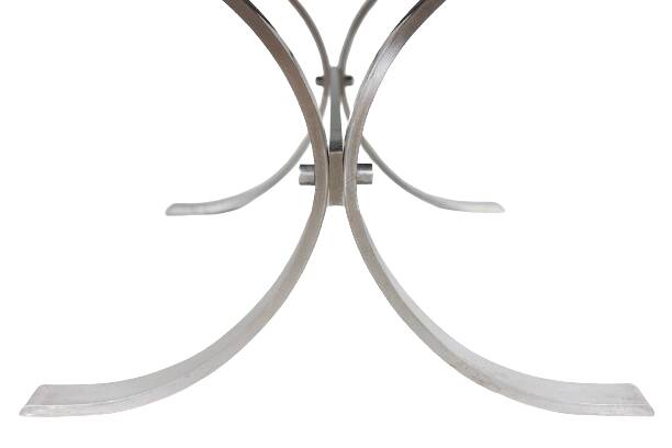 Polished metal and ceramic dining table. 1970s.