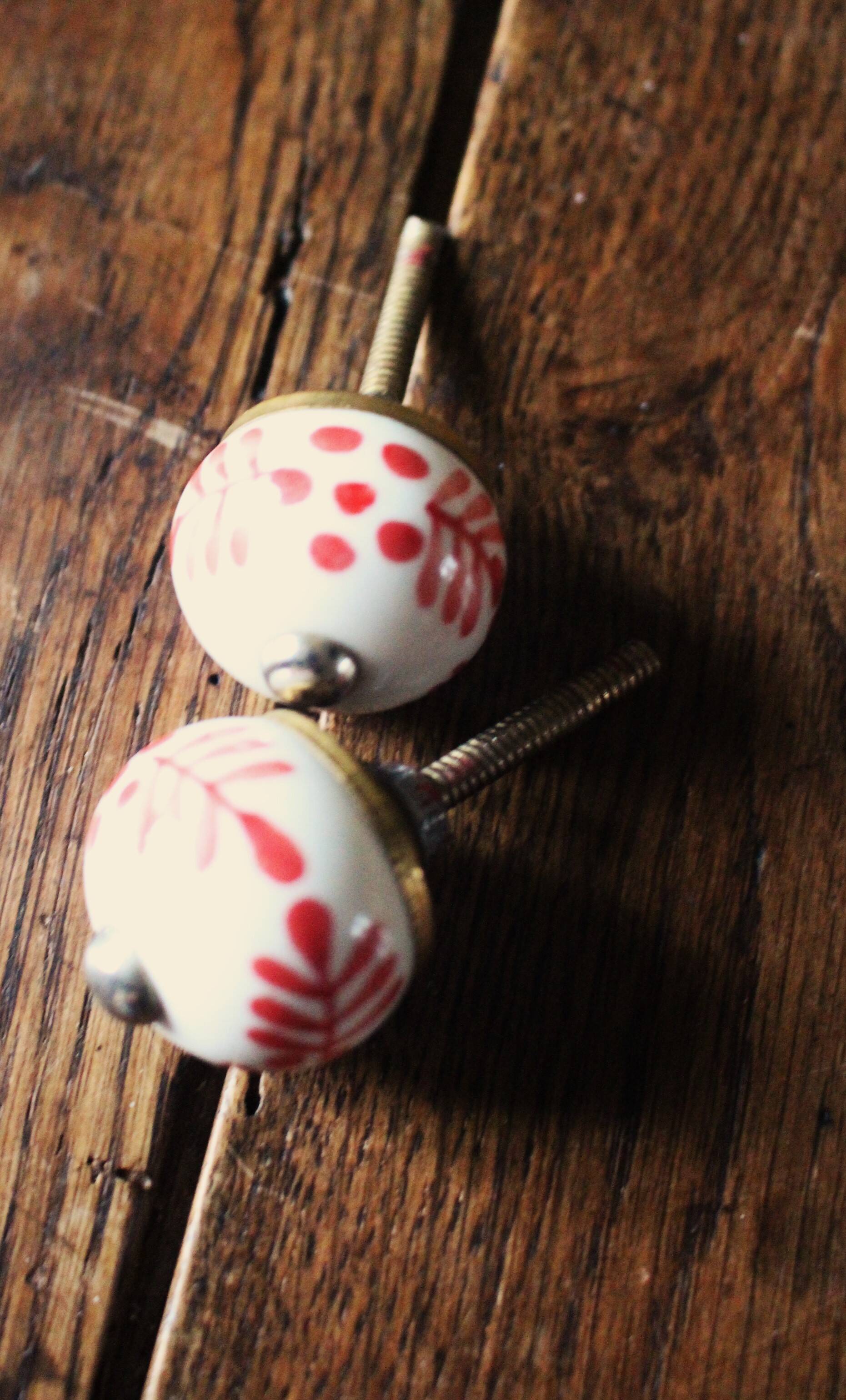 Pair of white and red porcelain drawer cupboard door knobs