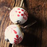 Pair of white and red porcelain drawer cupboard door knobs