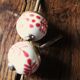 Pair of white and red porcelain drawer cupboard door knobs