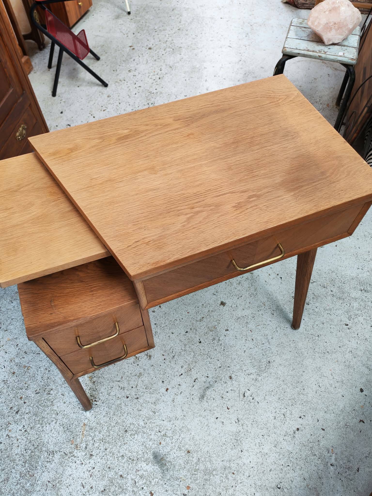 Vintage 1950s side desk with tapered legs.