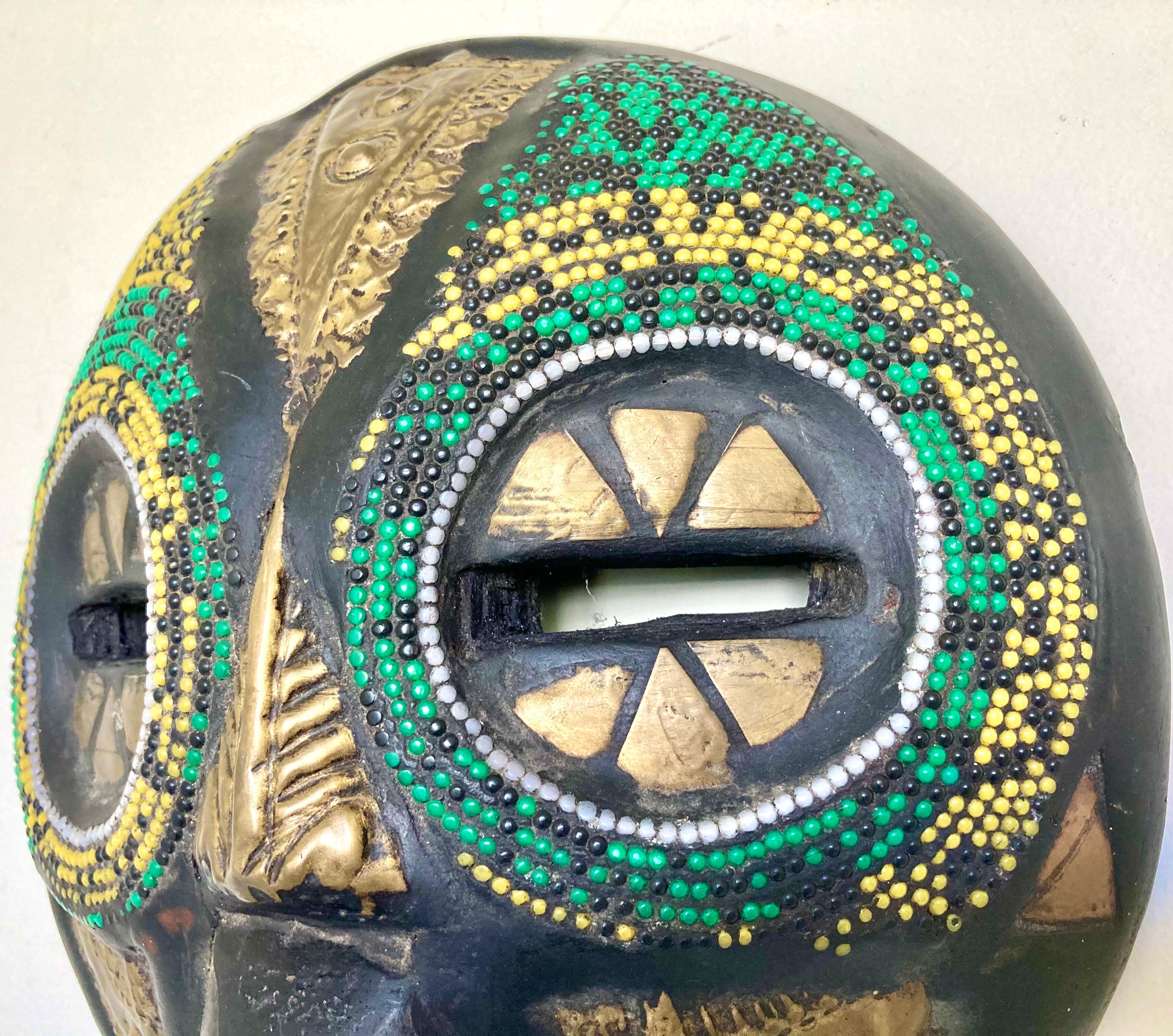 Vintage mask in carved wood beads and copper metal