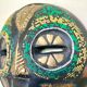 Vintage mask in carved wood beads and copper metal