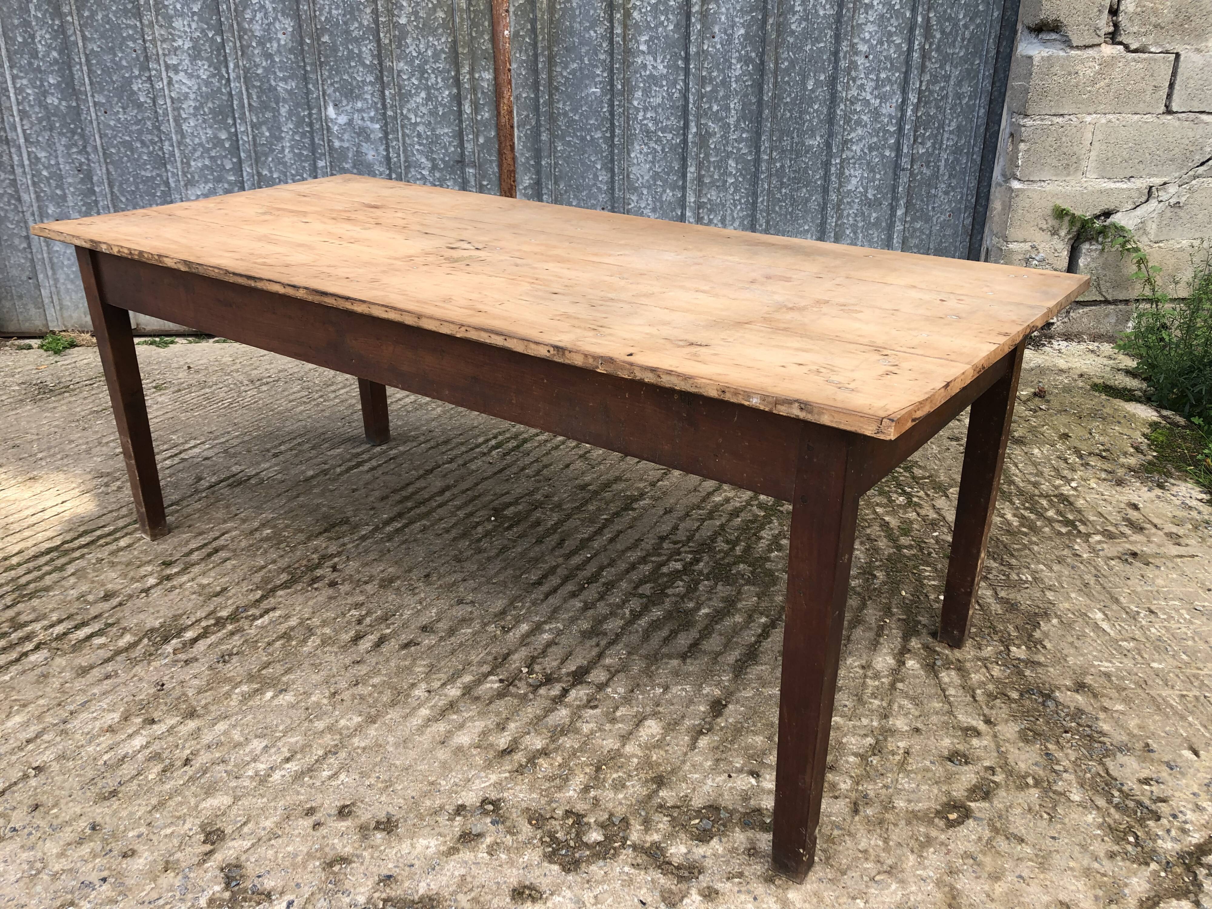 Rustic antique farmhouse table in solid cherry wood.