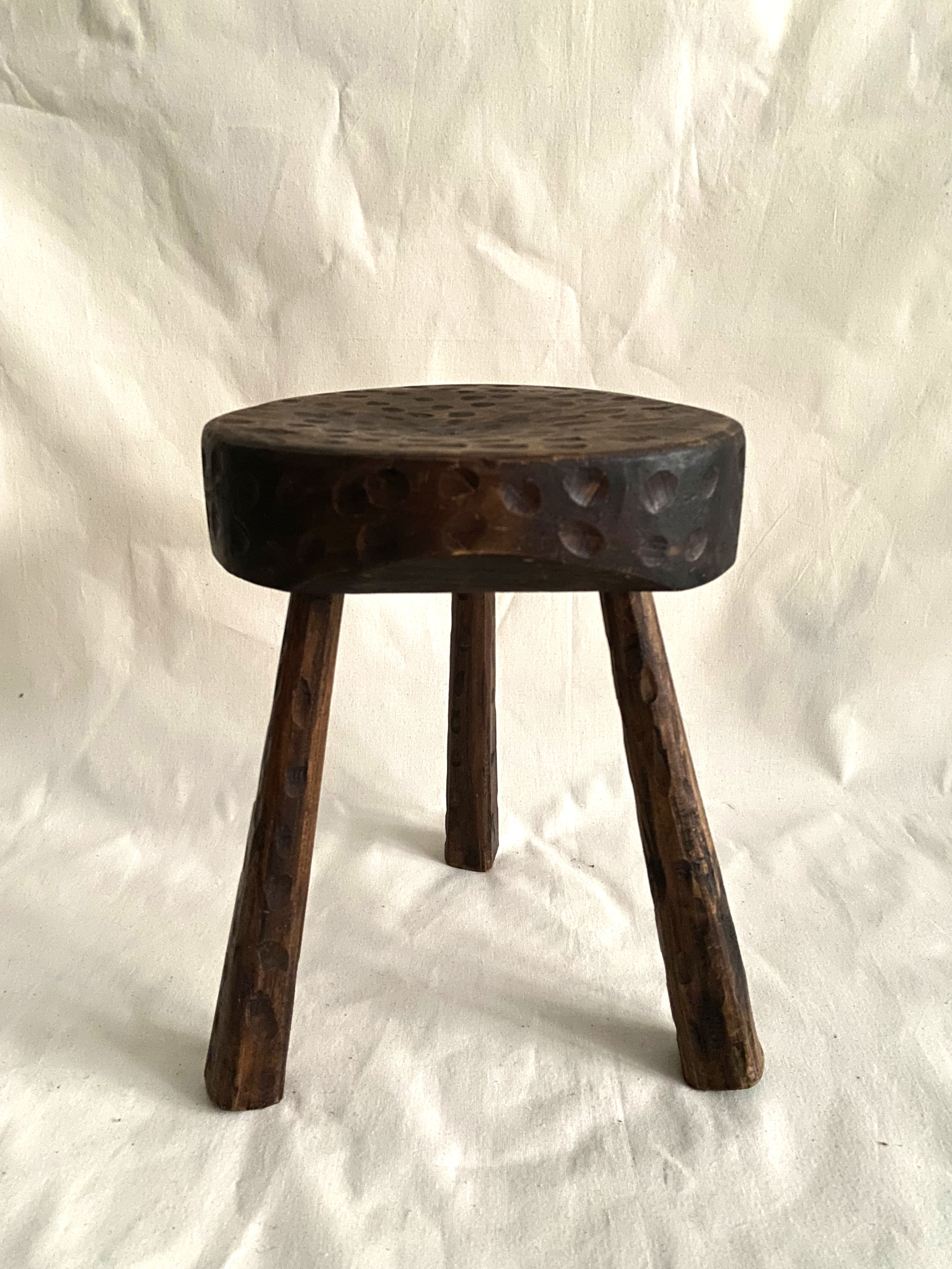Brutalist tipode stool in carved wood
