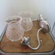 Pair of wall brackets in chromed metal and cut glass