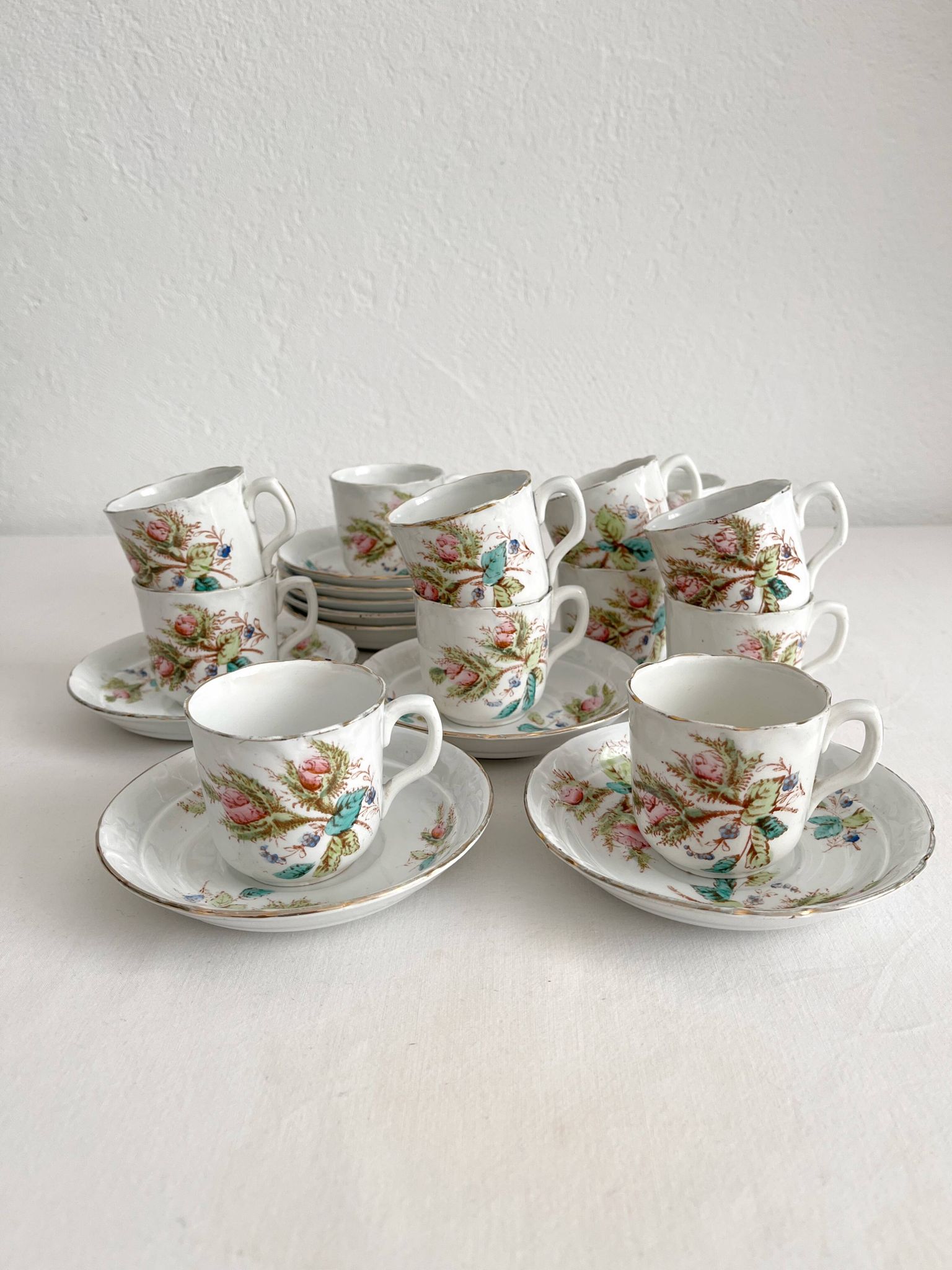 12 ironstone coffee cups with polychrome floral decoration, KG Lunéville