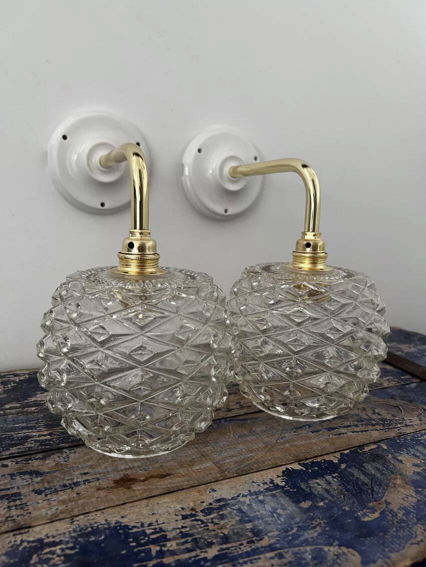 Pair of chiseled glass wall sconces