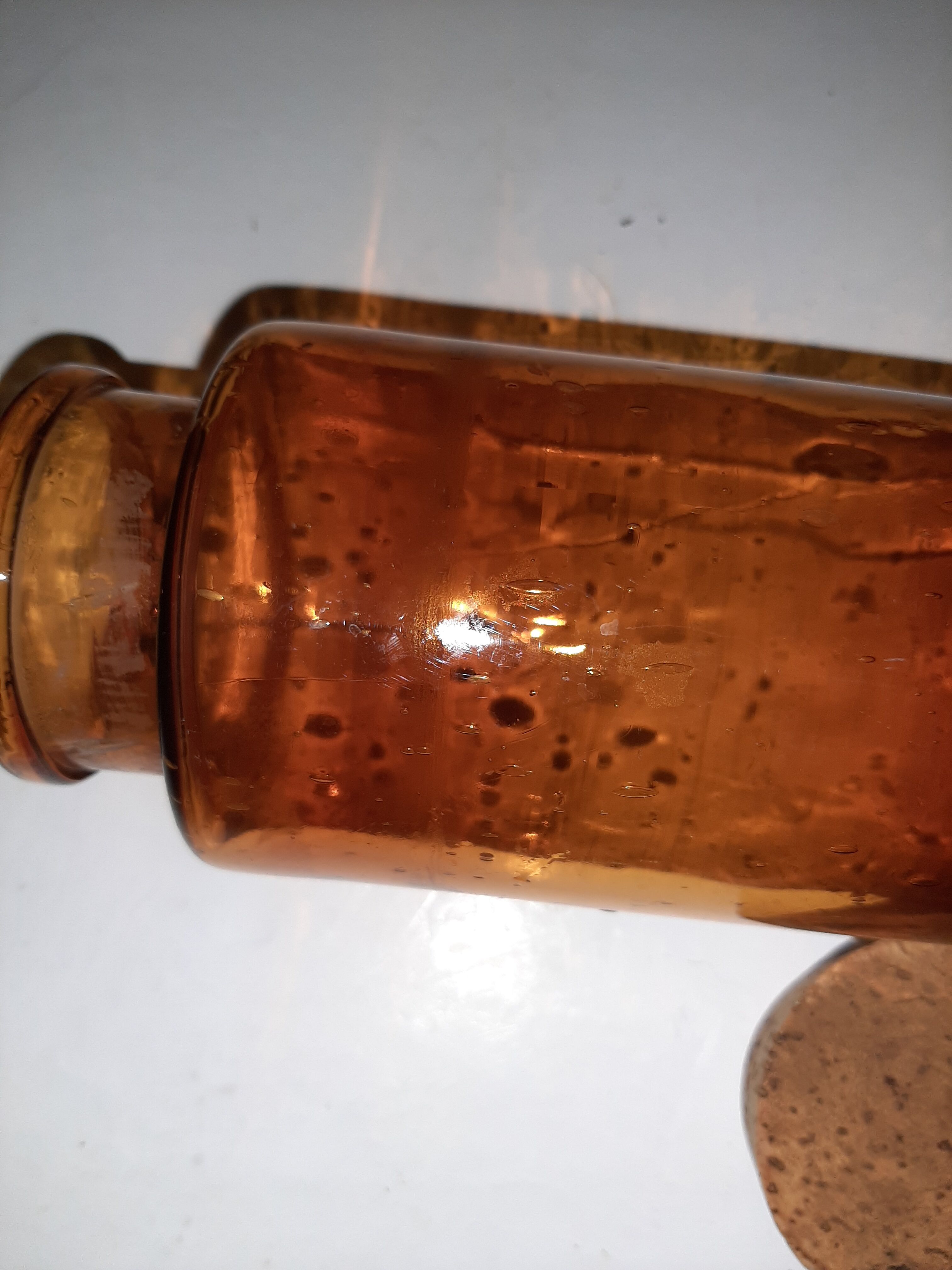 Amber pharmacy bottle made of old bubbled glass