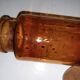 Amber pharmacy bottle made of old bubbled glass