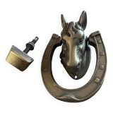 Horse head on horseshoe door knocker