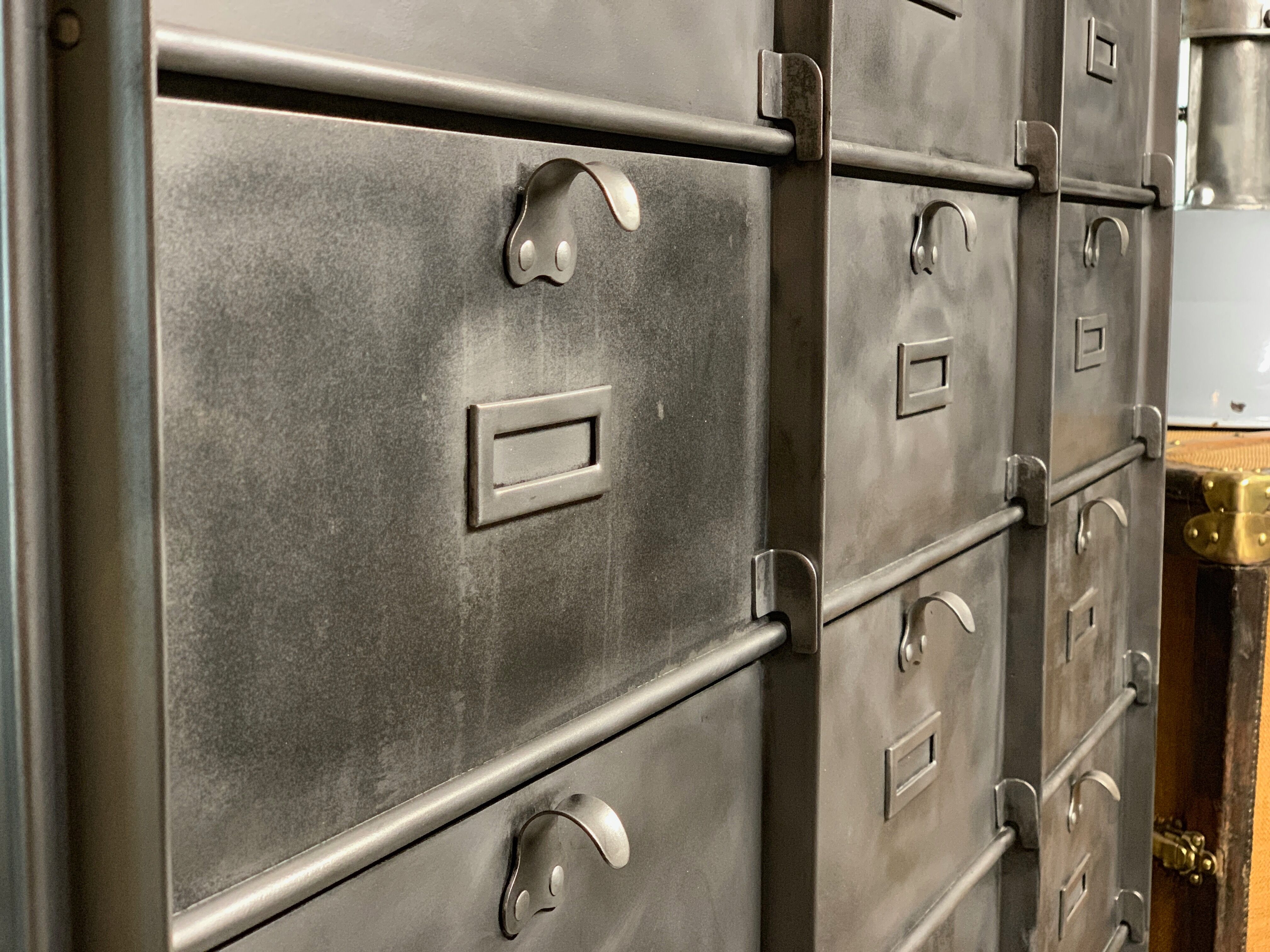 Industrial cladding furniture in brushed and patinated steel