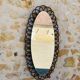 Miroir ovale en bambou et rotin, circa 1960
