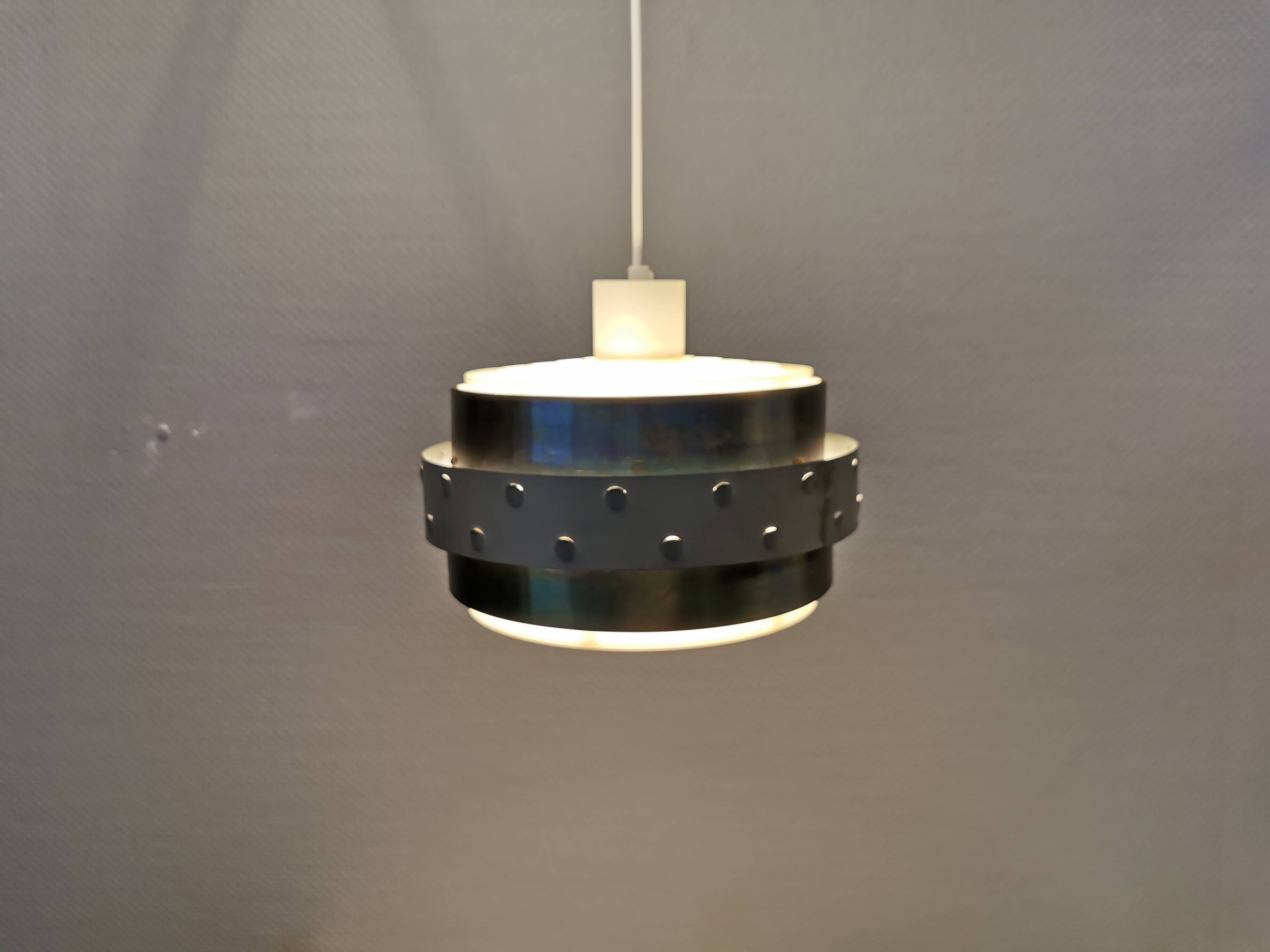 Metal hanging lamp with top and bottom grid of hard moulded plastic. Estimated 1970s.