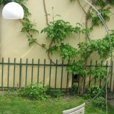 Lampadaire Arc - télescopique - piètement en travertin -