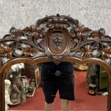 Very important Black Forest mirror in molded and carved wood