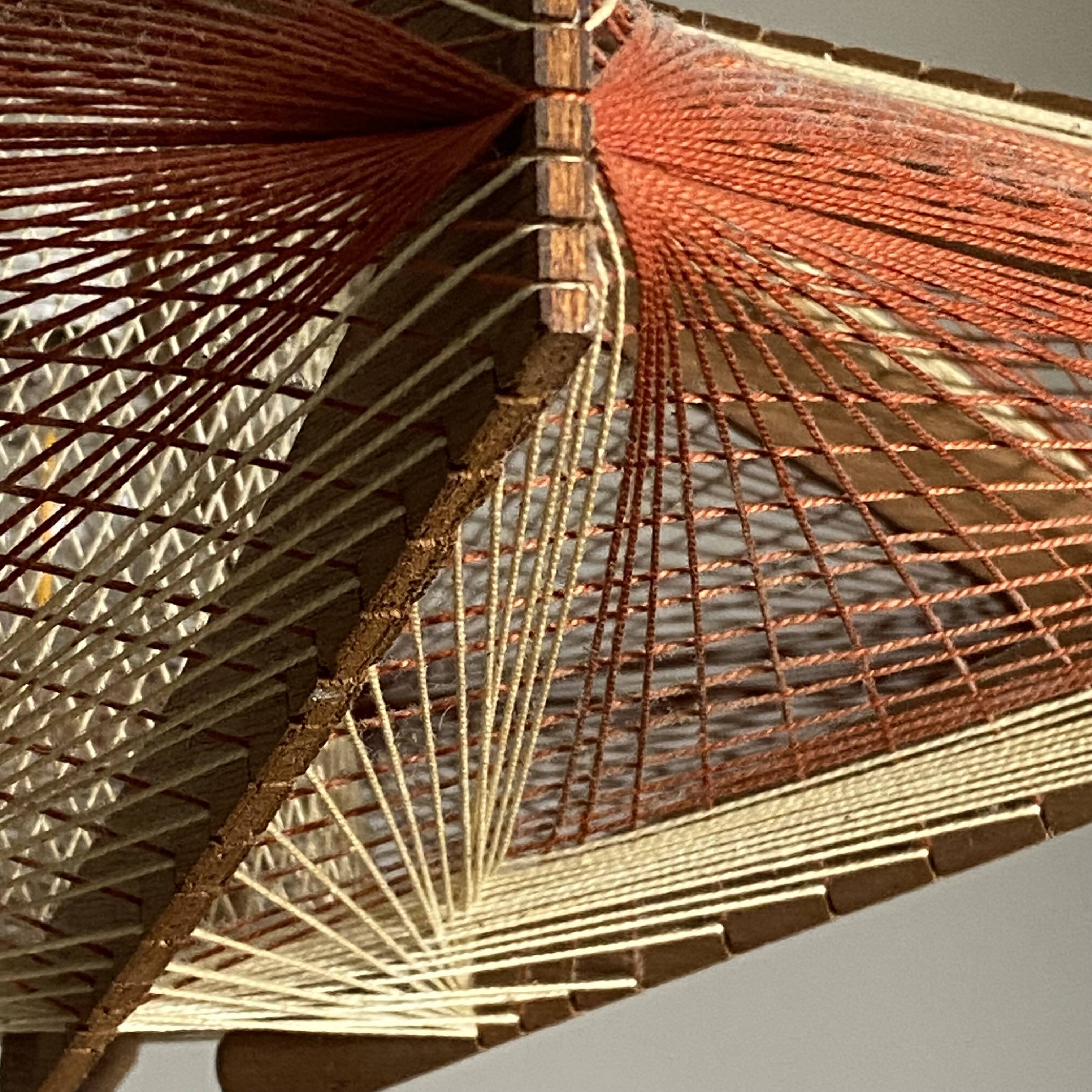 Vintage Scandinavian pendant light with stretched wires.