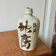 Old Japanese sake bottle in tokkuri shape.