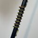 Design floor lamp in black lacquered metal and brass.