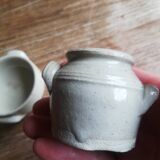 Set of 2 small glazed beige stoneware pots with handles