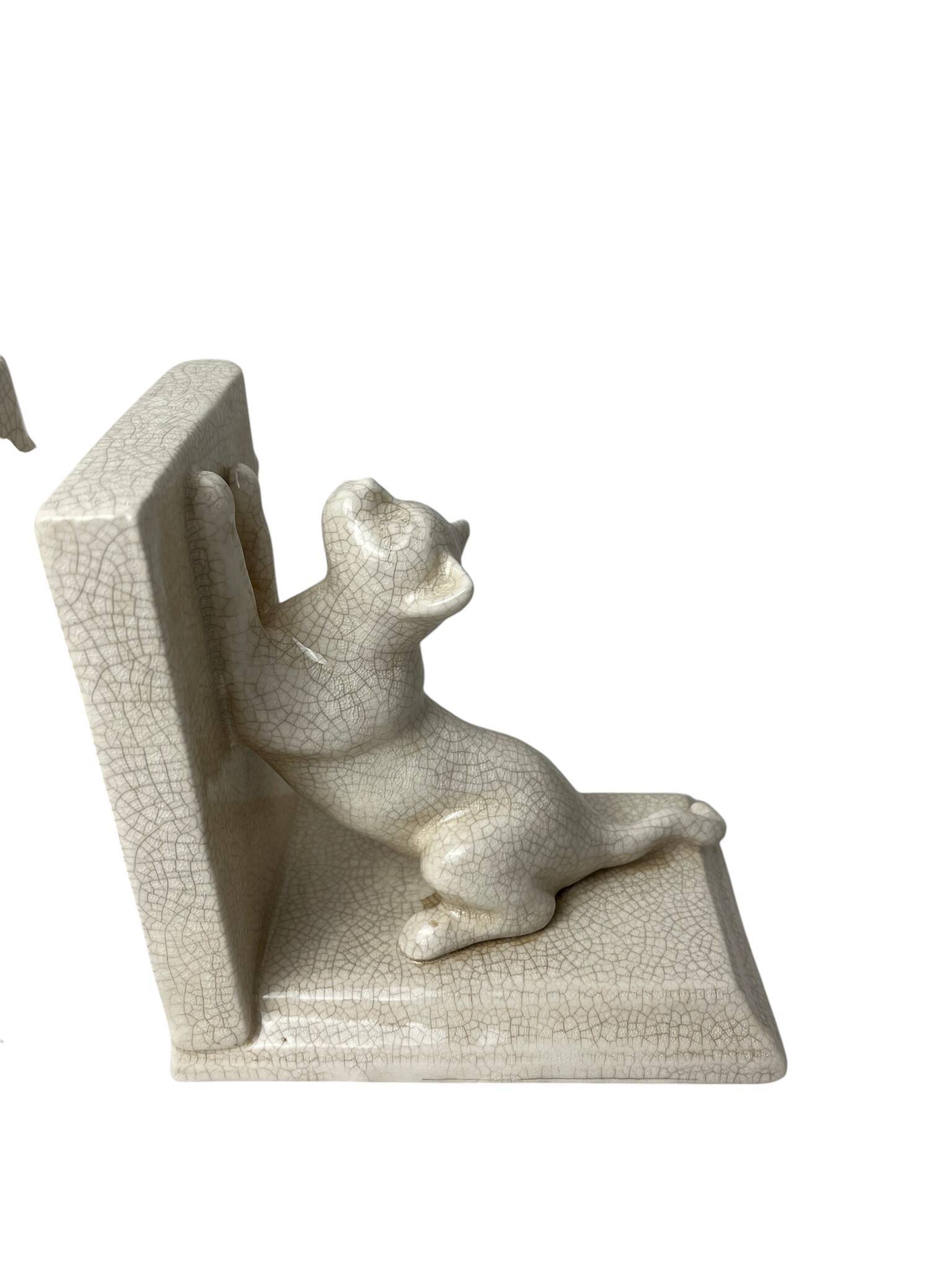 Art Deco, pair of crackled earthenware bookends featuring cats from Louvière around 1930.