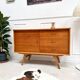 Sideboard with compass feet