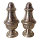 Silver-plated salt and pepper shakers, fluted, beaded decoration.