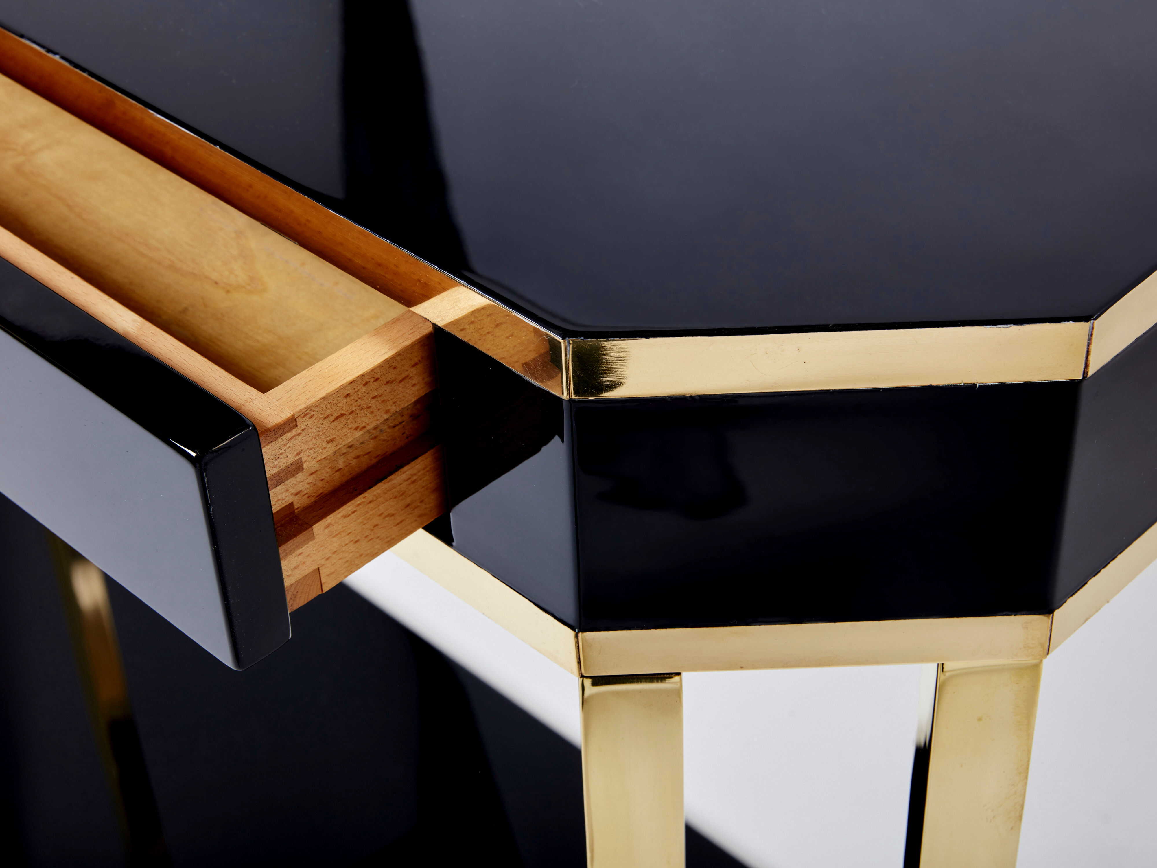 Pair of black lacquered consoles and brass 1970