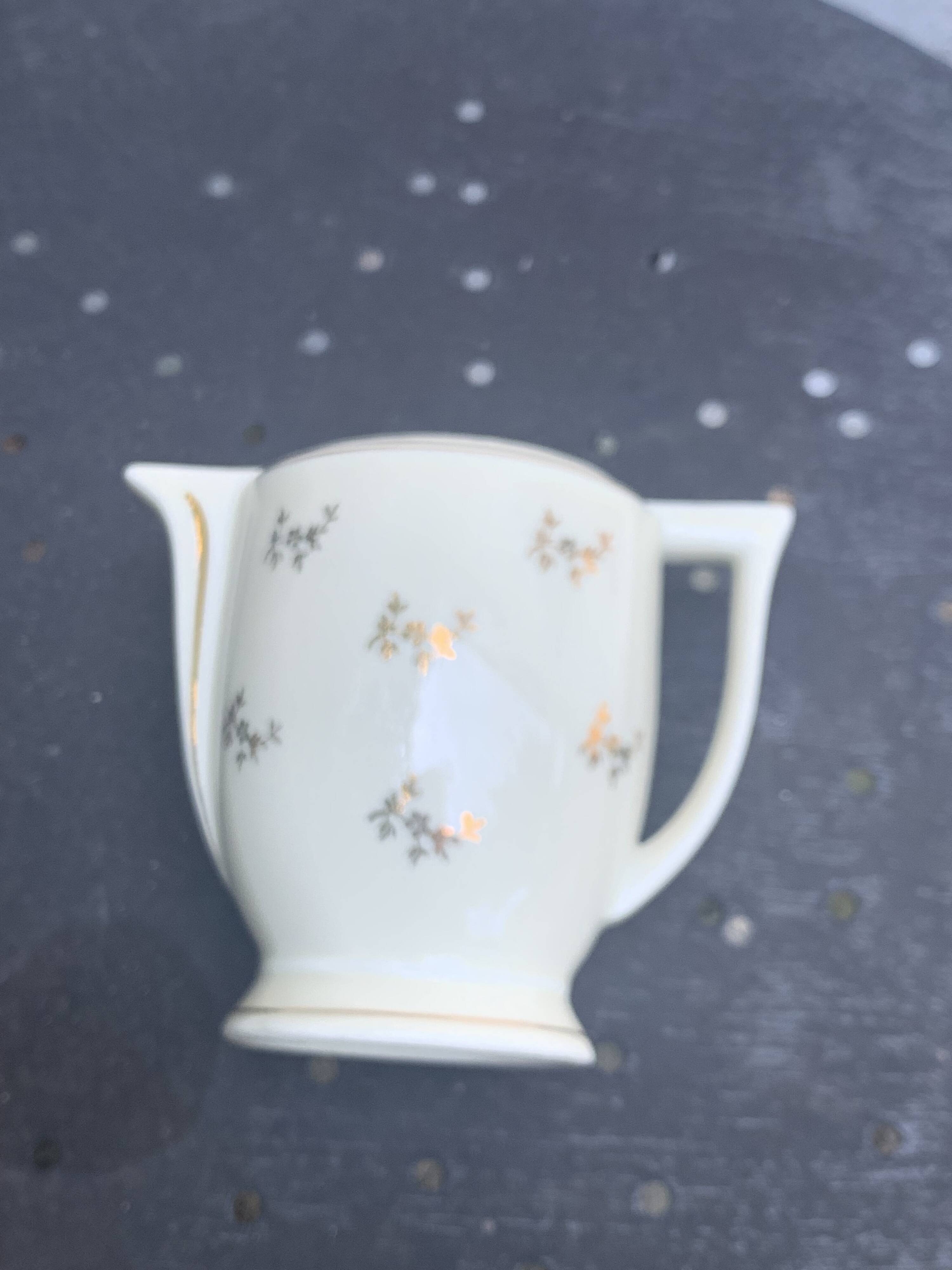 Antique porcelain sugar bowl and milk jug from the Royal Factory of Limoges, France