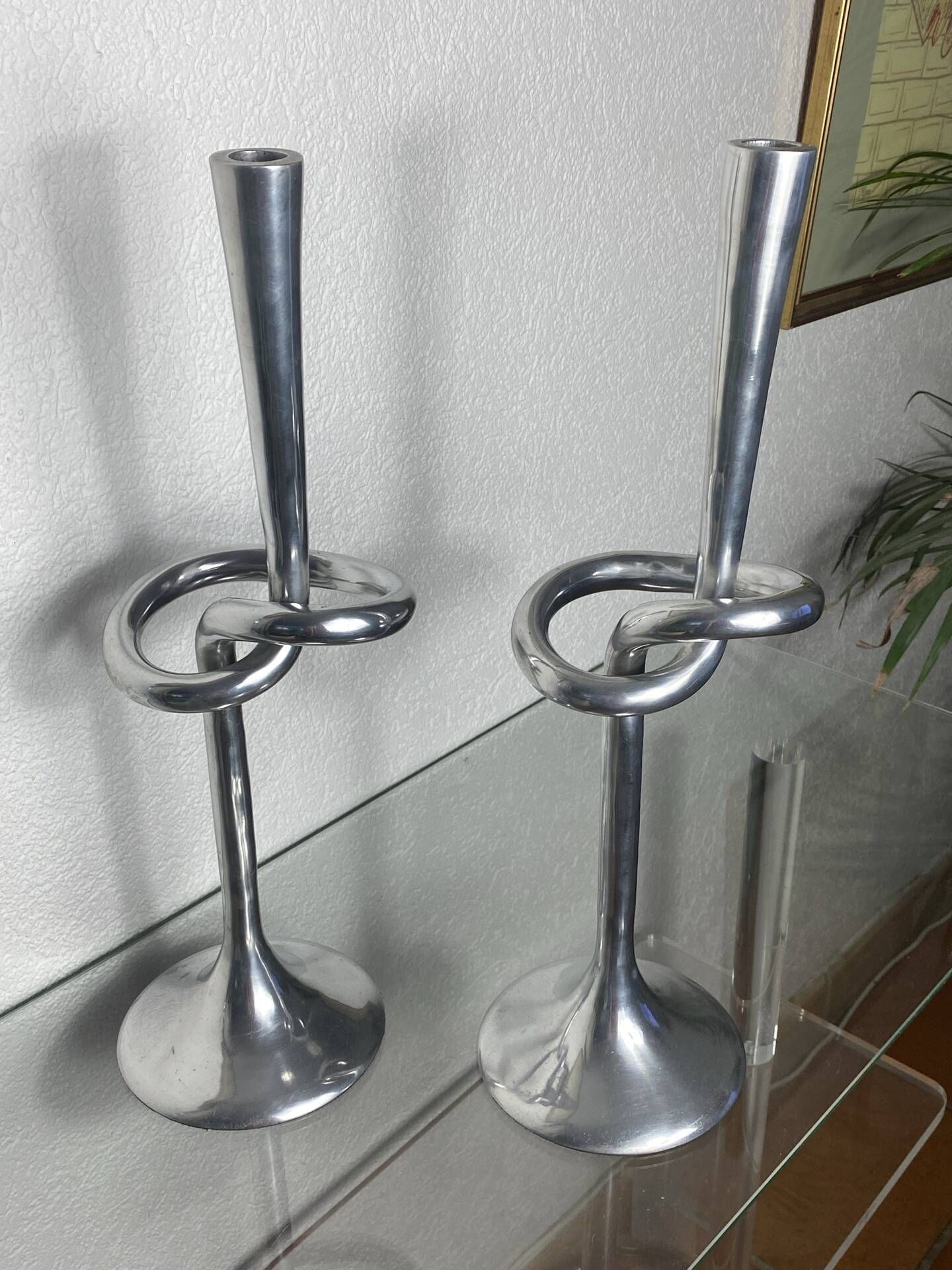 Pair of large aluminium bow candlesticks, Italy, 1970.