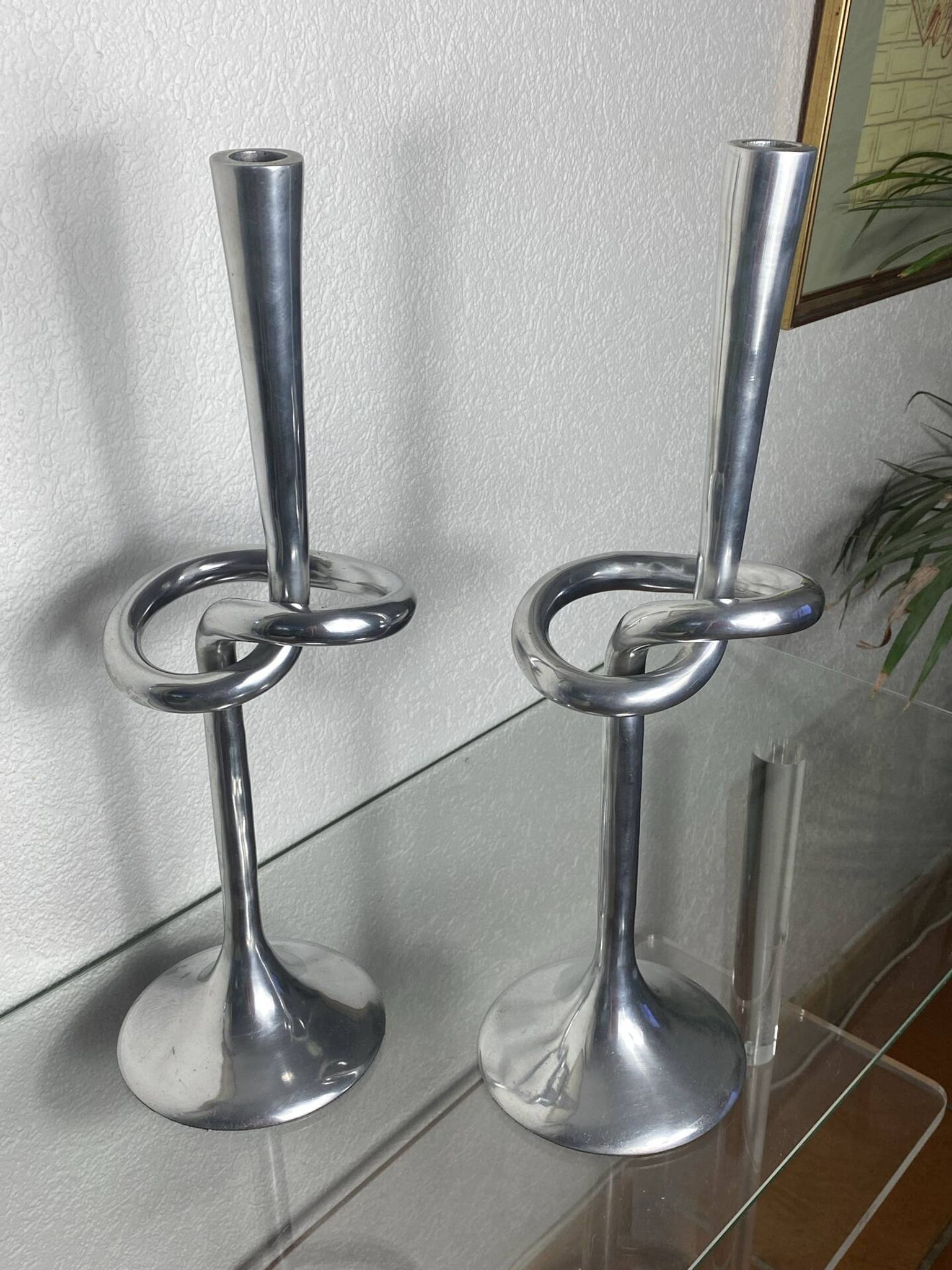 Pair of large aluminium bow candlesticks, Italy, 1970.