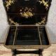 Lacquered work table, blackened wood decorated with Chinese scenes, Napoleon III period circa 1850