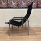 Reclining armchair in black leather and chrome design "hans eichenberger" 1960.