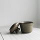 Gray and white speckled ceramic pot.
